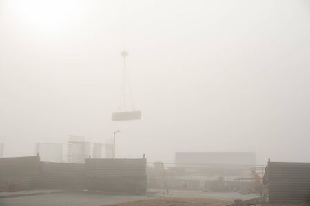 Construction site on a foggy autumn dayの写真素材
