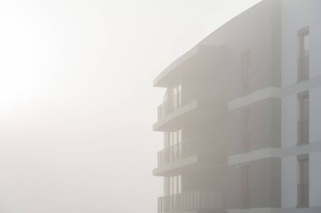 Modern apartment buildings in a foggy morningの写真素材