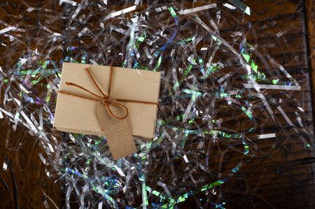 Little gift box on the dark wooden table