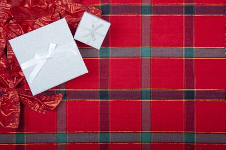 Chrismas gift boxes on the red checkered tableclothの写真素材