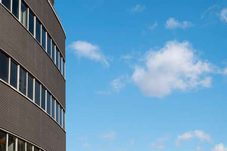 Facade of modern office building in the city on a sunny summer day