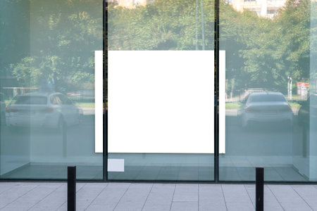 Blank white advertising poster in the shopwindowの写真素材