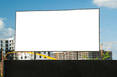 Blank white advertising billboard on the construction site area