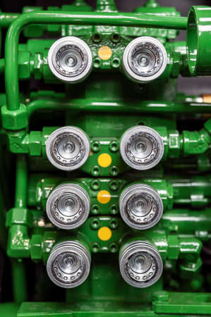 Close-up of industiral machine valves.