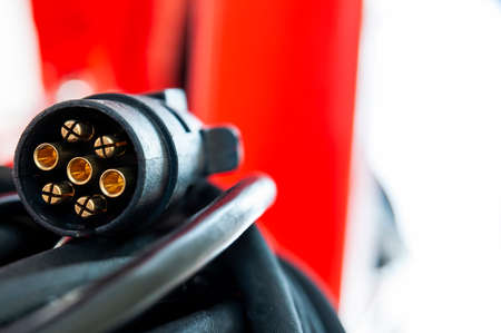 Close-up of electric wire with plug. Industrial machine element.