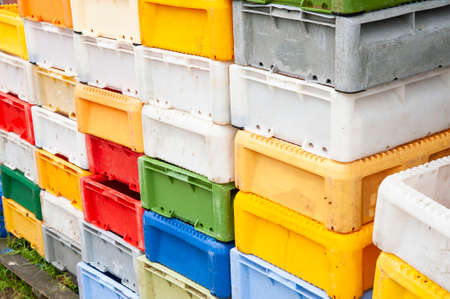Colorful plastic fish crates in harborの写真素材