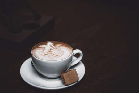 Cappuccino coffee with biscotti biscuitsの写真素材