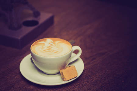 Cappuccino coffee with biscotti biscuitsの写真素材