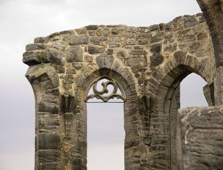 Broken window of a ruined castleの写真素材