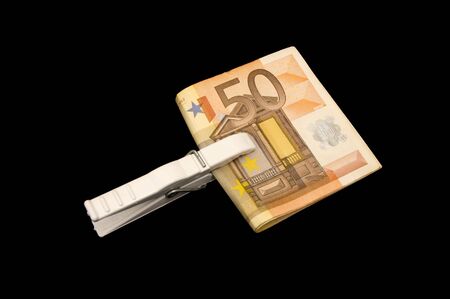 50-Euro bills held together by a clothespinの写真素材