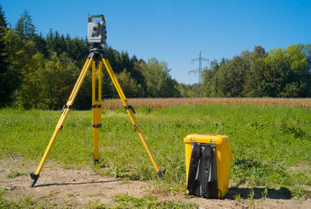Surveying High Voltage Power Lines - Total Station in the Fieldの写真素材