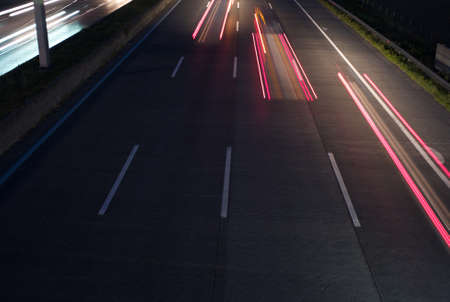 Tree Red Automobile Tail Lights on the Freeway - Long Exposure