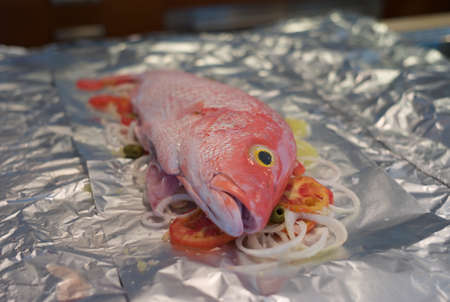 Raw Fish on Tomatoes and Onions