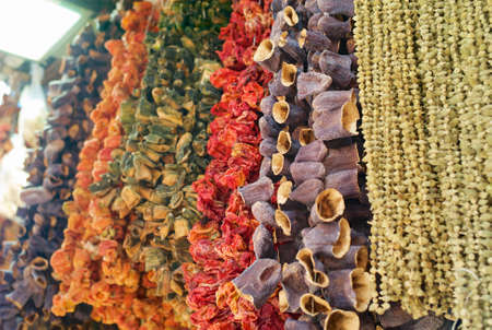 Dried Eggplants, Peppers, Tomatoes and Other Dried Vegetables Hanging on a String at the Egyptian Bazaar or Spice Bazaar in Istanbul, Turkeyの写真素材