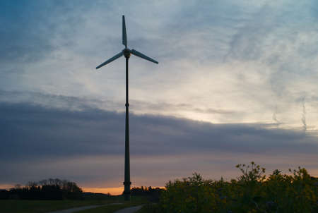 Small Electric Wind Power Station with One Tower in Morning Light at Dawnの写真素材