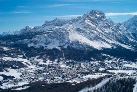 The Romantic, Snow Covered Skiing Resort of Cortina d' Ampezzo in the Italian Dolomites seen from Tofana with Col Druscie in the foreground.の写真素材