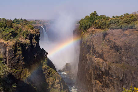 Victoria Falls and Gorge with Rainbow, Zambezi River, between Zimbabwe and Zambia, Africaの写真素材