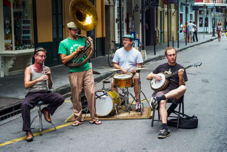 New Orleans, Louisiana, United States - July 17 2009: Jazz Band with Sousaphone, Clarinet, Banjo and Drums Playing Outdoors on Bourbon Street.のeditorial素材