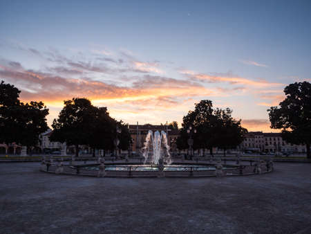 Fountain in the Prato della Valle Square on Isola Memmia in Padova, Italy at Sunrise or Dawn in the Early Morningの写真素材
