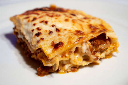 Lasagne alla Bolognese, Baked with Meat Ragu on a White Plateの写真素材