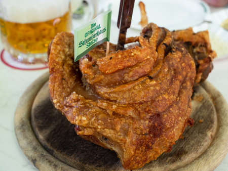 Vienna, Austria - June 4 2021: Roast Rear Knuckle of Pork at the Schweizerhaus Inn and Beer Garden in the Prater.のeditorial素材