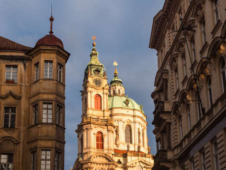 Baroque Dome and Spire of Saint Nicholas Church in the Lesser Town of Prague, Czech Republic in the Morningの写真素材