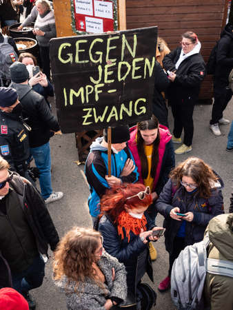 Vienna, Austria - November 20 2021: Anti-Vax Covid-19 Demonstrator Holdig Sign 'Gegen jeden Impfzwang' or 'Against all Vaccination Coercion'.のeditorial素材
