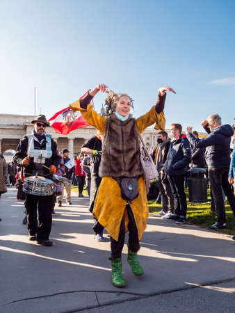Vienna, Austria - November 20 2021: Anti-Vaccination Protester at Demonstration on Heldenplatz in Vienna, dancing in Costumeのeditorial素材