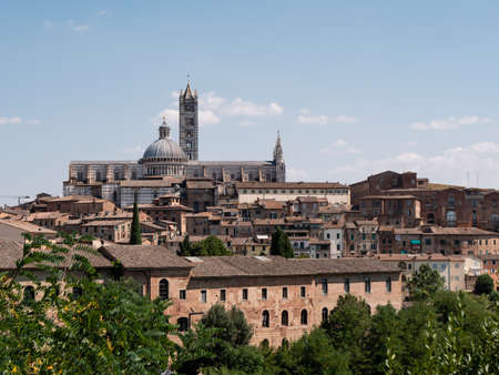 Siena Cityscape with Duomo or Cattedrale Metropolitana di Santa Maria Assunta Cathedral and Towerの写真素材