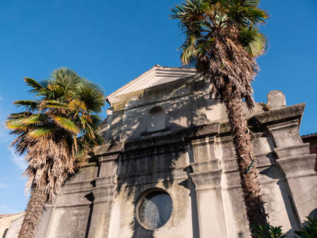 Chiesa San Rocco Church in Grado, Italy Facade with Palm Treesの写真素材
