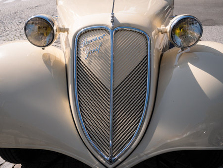 Mariazell, Austria - September 26 2021: Stoewer Greif Junior 1937 Convertible Car in Beige or Ivaory Color Radiator Detailのeditorial素材