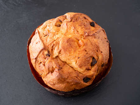 Whole Panettone Italian Sponge Cake or Sweet Bread from Milan, Served Traditionally for Christmasの写真素材