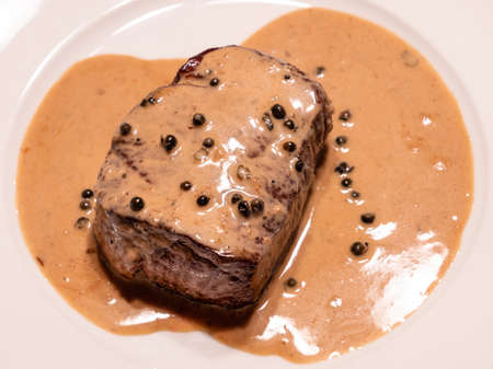 Tenderloin Steak with Green Pepper Sauce or Filet Mignon and Sauce Pouvre Vertの写真素材