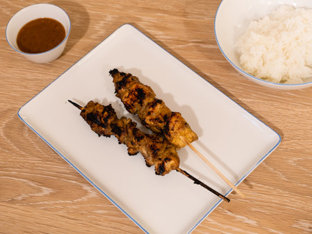 Grilled Chicken Satay BBQ Skewer or Sate ayam with Rice and Peanut Sauceの写真素材