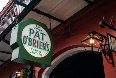 New Orleans, Louisiana, United States - July 17 2009: Pat O'Brien's Courtyard Resstaurant and Bar Entrance Sign or Logo on Bourbon Street in the Vieux Carre.のeditorial素材