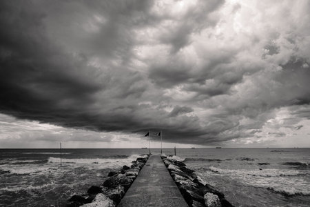 Summer Storm Clouds on Lido di Venezia Beach in Venice, Italy in Monochrome Black and Whiteの写真素材