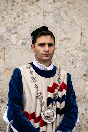 Siena, Tuscany, Italy - August 15 2022: Istrice or Porcupine Contrada Member in Renaissance Historical Costume at the Palio di Sienaのeditorial素材