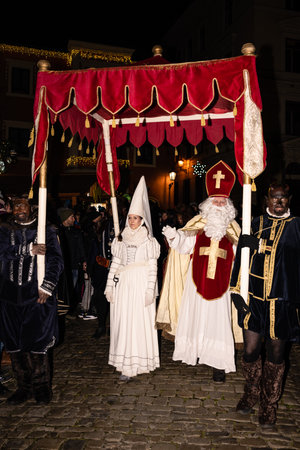 Cesky Krumlov, Czech Republic - December 4 2022: Saint Nicholas or Santa Claus and White Lady called Bila Pani Perchta Rozemberka or Bertha of Liechtenstein at the Saint Nicholas celebration.のeditorial素材