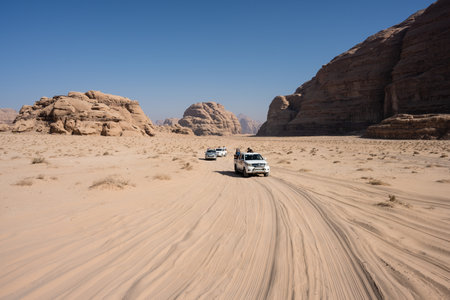 Wadi Rum, jordan - October 30 2022: Toyota Hilux Pickup Trucks Driving through the Desert in Wadi Rum, Jordanのeditorial素材
