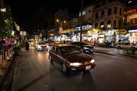 Amman, Jordan - October 23 2022: King Faisal Street in Downtown Amman at Night with Trafficのeditorial素材