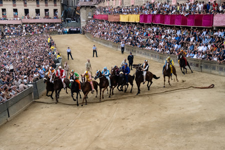 Siena, Italy - August 17 2021: Mossa or Start of the Public Horse Race Palio di Siena on the Main Squareのeditorial素材