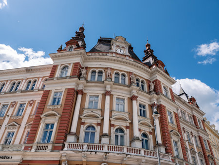 Old Main Post Office Building Exterior in Karlovy Vary, Czech Republic from the Austro Hungarian Empire with Four Allegorical Statues Representing Telegraph, Railway, Ship Transport and Mailの写真素材