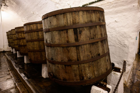 Plzen, Czech Republic - August 17 2024: Open Bottom Fermentation of Beer in Old Wood Casks in the Cellar of the Pilsner Urquell Plzensky Prazdroj Brewery.のeditorial素材