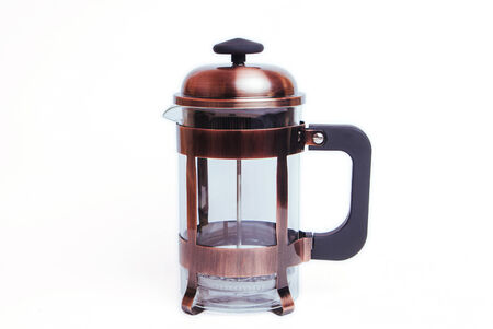Empty transparent french press coffee and tea maker isolated on white, brown metallic still frenchpressの写真素材