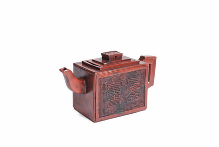 Traditional Chinese earthenware brown teapot decorated with hieroglyphsの写真素材