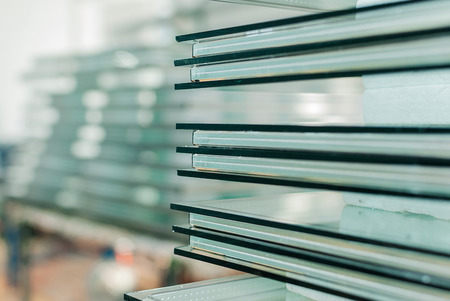 Sheets of Factory manufacturing tempered clear float glass panels cut to sizeの写真素材