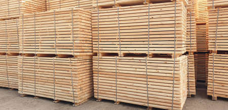 Stacks of wooden materials at the lumber warehouseの写真素材