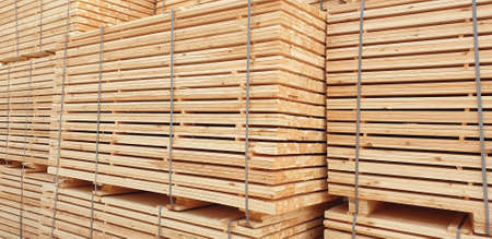 Stack of lumber at warehouseの写真素材