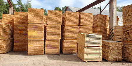 Stack of natural wooden planks. Wooden boards, lumber industryの写真素材
