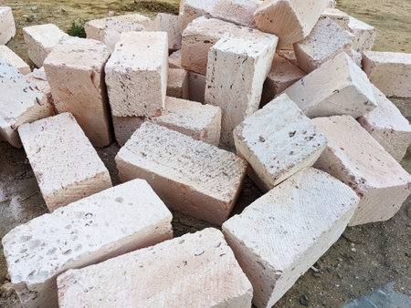 Building blocks of shell bricks construction material scattered at the construction site.の写真素材